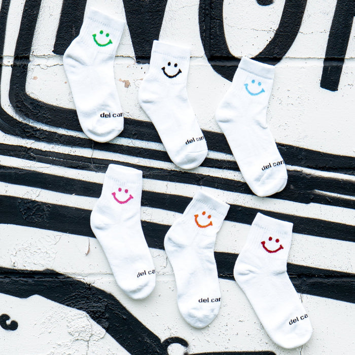 Del Campo Smiley Pack golf socks featuring all six smiley designs: classic, blue, green, pink, orange, and red