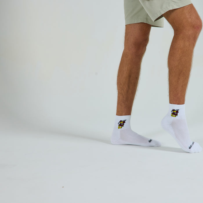 Man wearing Del Campo South Carolina Cocky golf socks, studio shot, no shoes