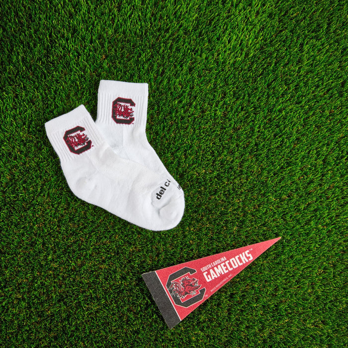 Del Campo South Carolina Gamecocks golf socks on turf with a team pennant