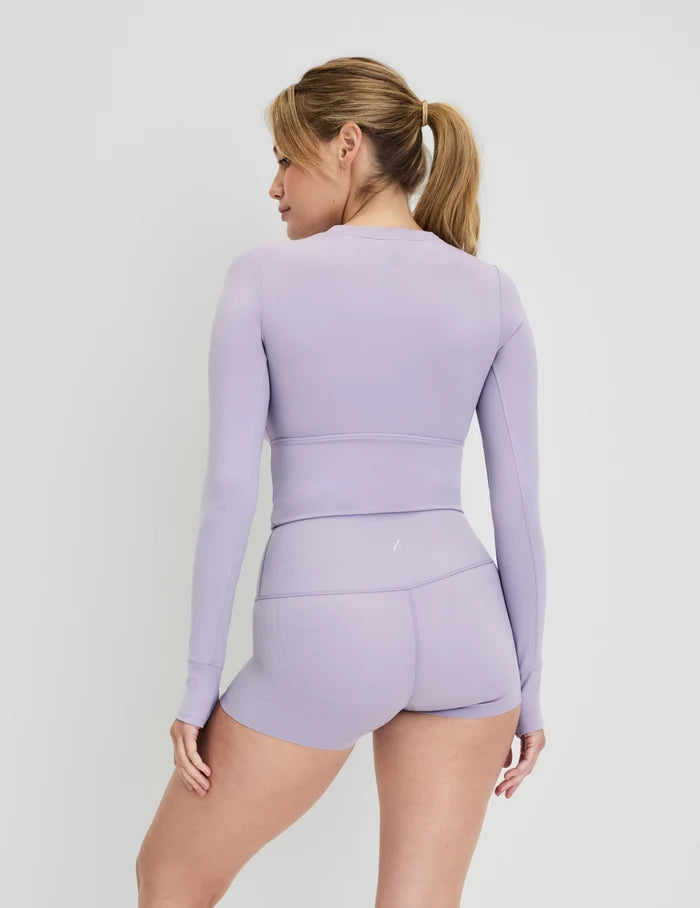 | Front view of model wearing the Studio Cutout Bra Top, highlighting the keyhole neckline, flattering design, and silhouette | Purple Heather
