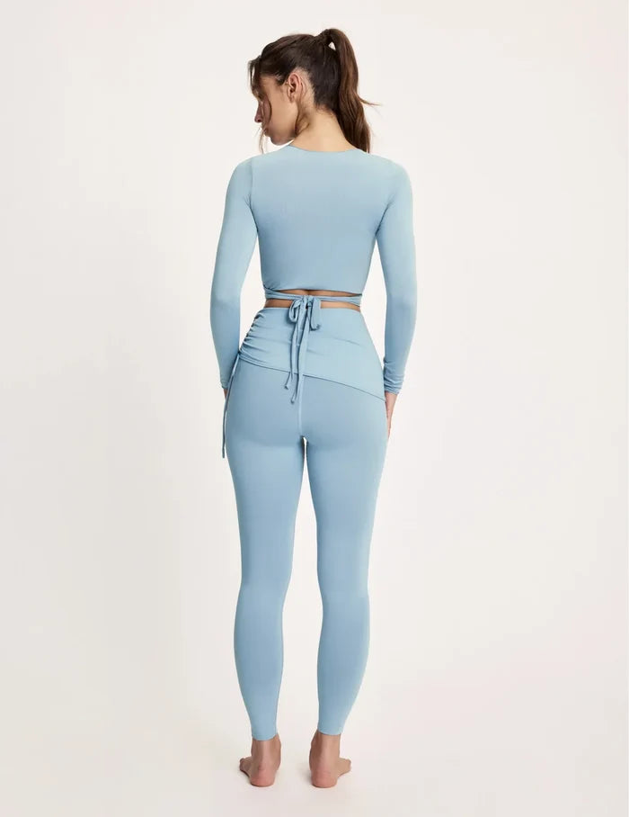 Maya is 5’10”, and wearing KNIX S | Blue Mist