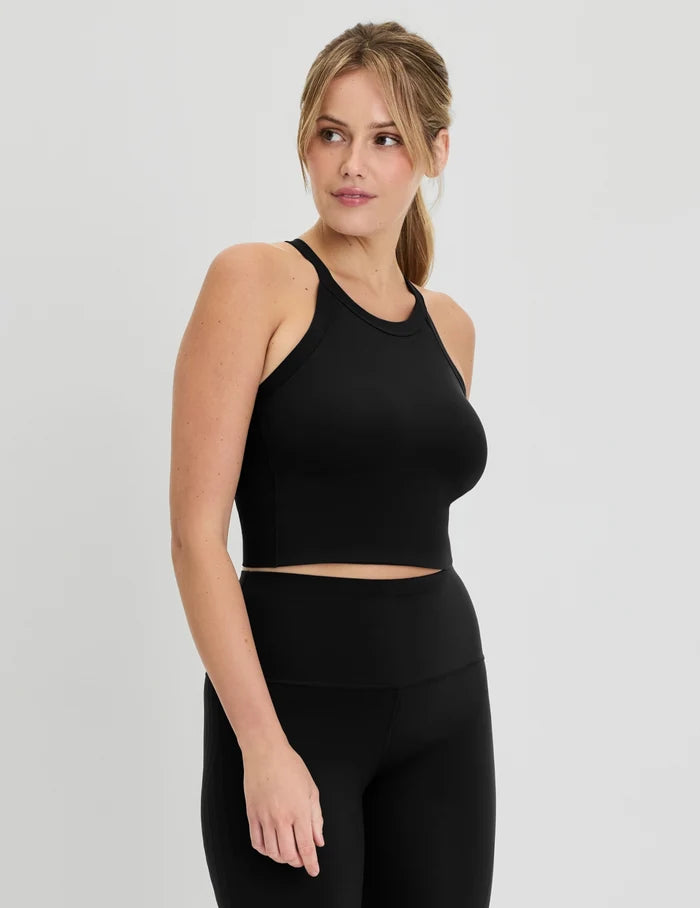 | Full-body view of model wearing the Studio Ribbed Bra Top, highlighting the neckline, design, and silhouette | Black