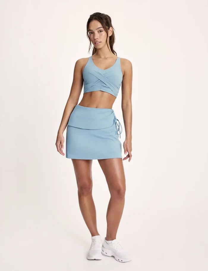 Maya is 5’10”, and wearing KNIX S | Blue Mist