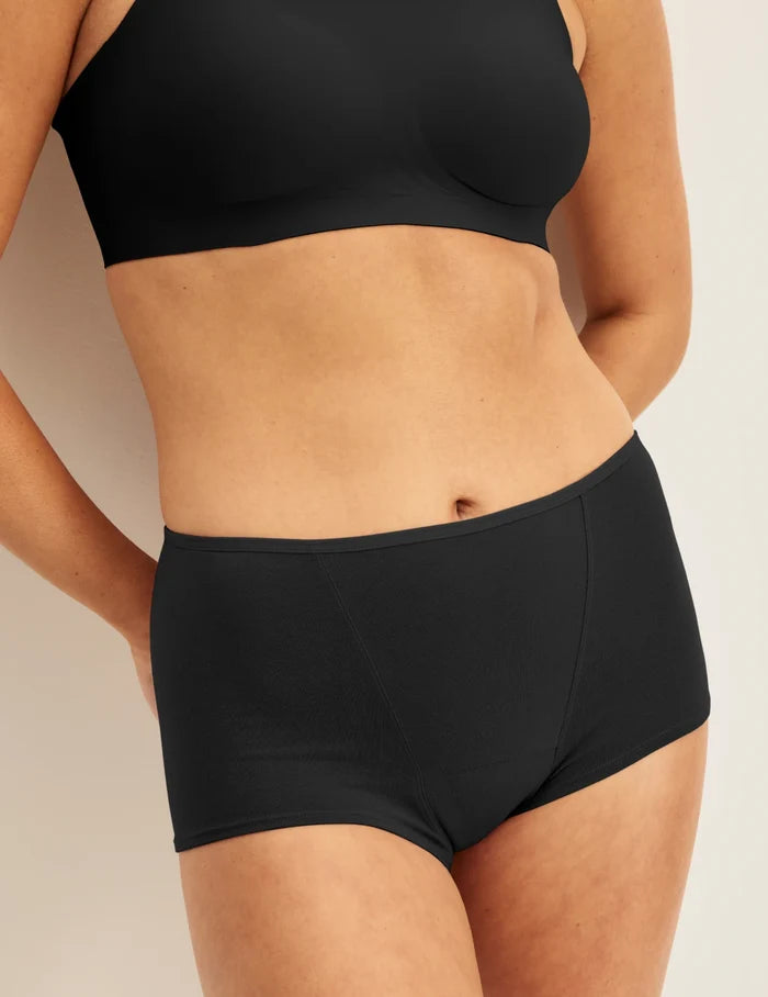 | Front view of model wearing the Super Leakproof® Cotton Boybrief, highlighting the coverage and fit | Black