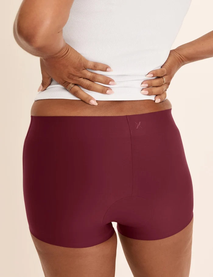 Maya has 40” hips and wears KNIX M | Back view of model wearing the Super Leakproof® Dream Short™ highlighting the coverage and smooth fit | Dark Cherry