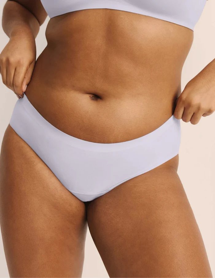 | Front view of model wearing the Super Leakproof® No-Show Bikini highlighting the coverage and smooth fit | Berry/Violet/Lavender