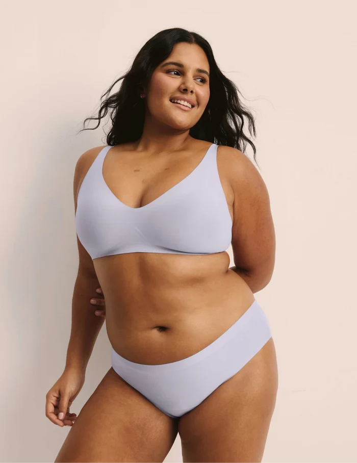| Full-body view of model wearing the Super Leakproof® No-Show Bikini highlighting the coverage and smooth fit | Berry/Violet/Lavender