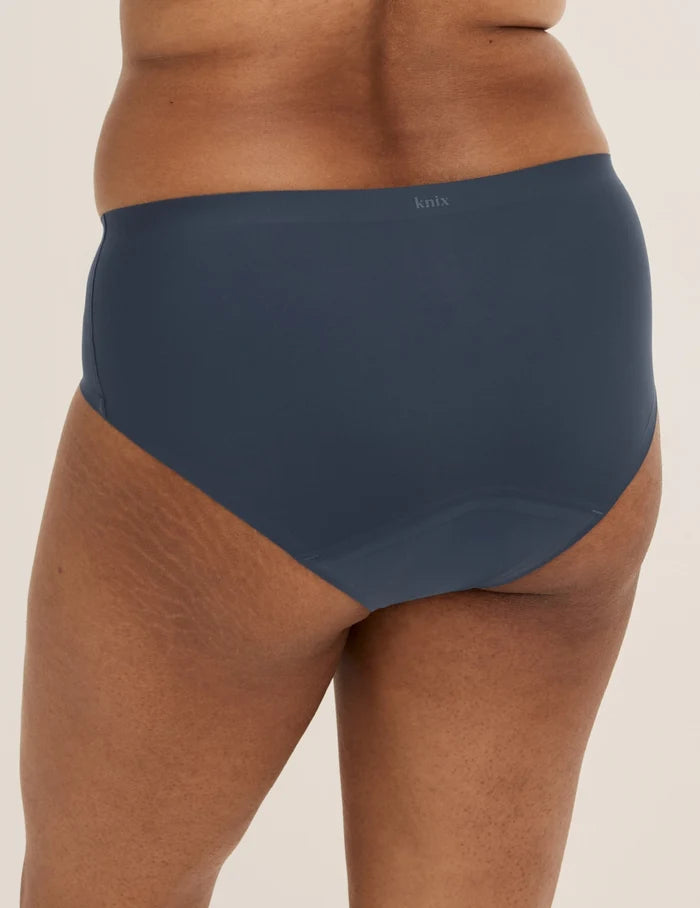 Shivani has 40” hips and wears KNIX L | Back view of model wearing the Super Leakproof® No-Show Boyshort highlighting the coverage and smooth fit | Twilight Navy