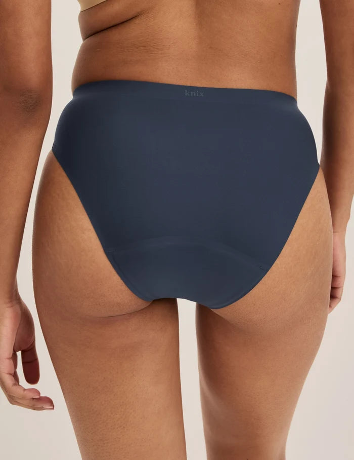 Ashley has 39” hips and wears KNIX S | Back view of model wearing the Super Leakproof® No-Show French Cut highlighting the coverage and smooth fit | Twilight Navy