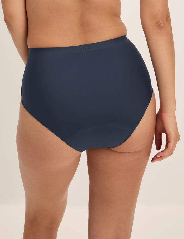 Megan has 36.5” hips and wears KNIX S | Back view of model wearing the Super Leakproof® No-Show High Rise highlighting the coverage and smooth fit | Twilight Navy