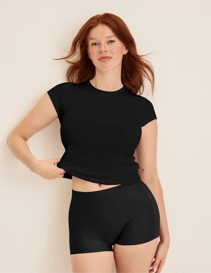 | Full-body view of model wearing the SuperPlus Leakproof® Dream Short highlighting the coverage and smooth fit | Black