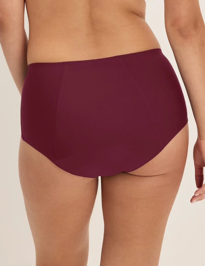 Megan has 36.5” hips and wears KNIX S | Back view of model wearing the SuperPlus Leakproof® No-Show Boybrief highlighting the coverage and smooth fit | Dark Cherry