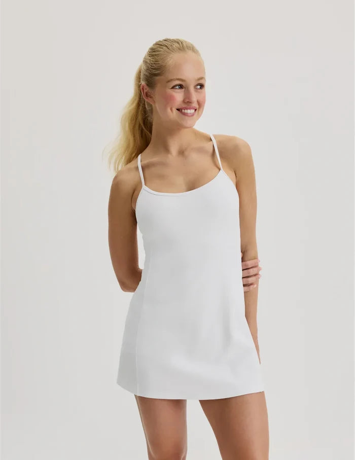 | Front view of model wearing the Teen First Serve Sport Dress highlighting the coverage and fit | White
