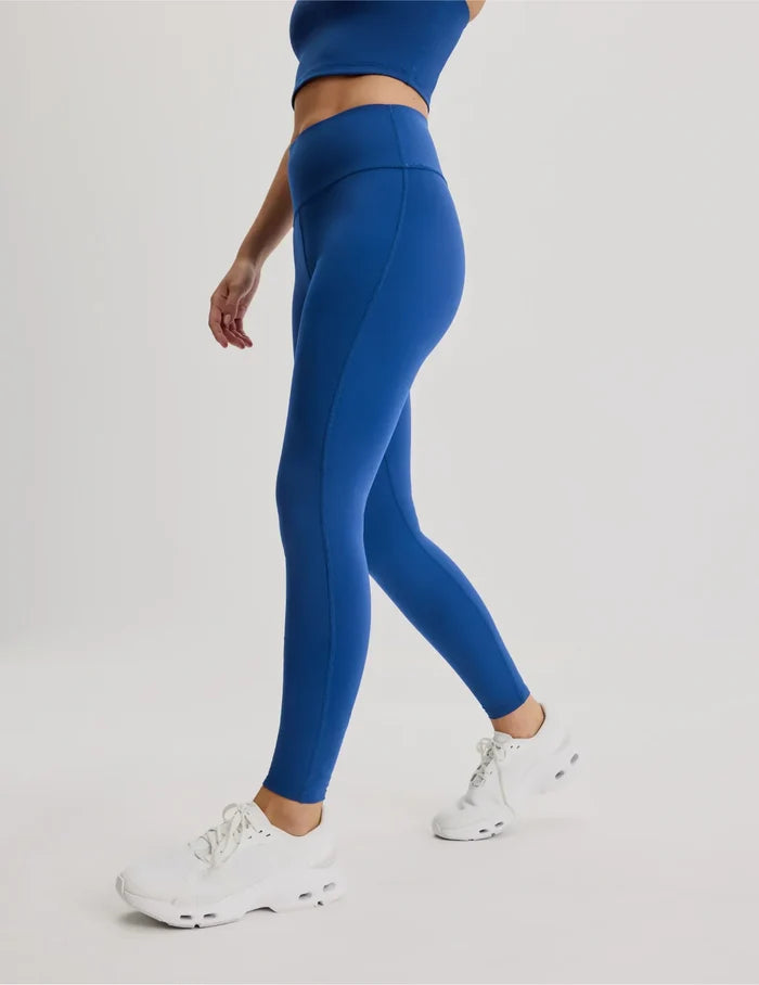 | Side view of model wearing the Teen Leakproof Active Legging highlighting the coverage and fit | Shady Blue