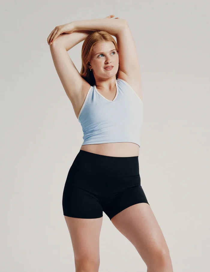 | Front view of model wearing the Teen Leakproof Active Short highlighting the coverage and fit | Black