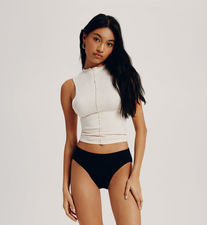 | Front view of model wearing the Teen Leakproof Cotton Bikini highlighting the coverage and fit | Black
