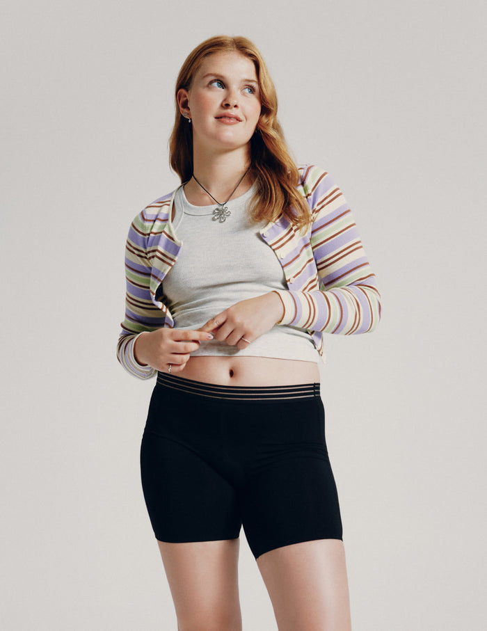 | Front view of model wearing the Teen Leakproof Luxe Modal Sleep Boxer highlighting the coverage and smooth fit | Black