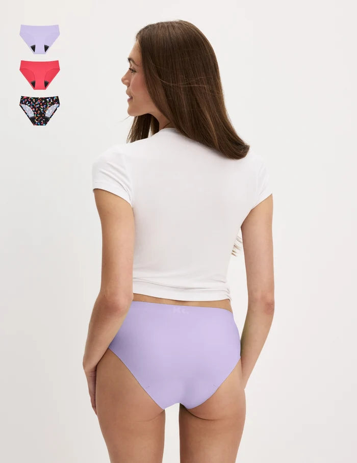 | Back view of model wearing the Teen Leakproof UltraThin Bikini highlighting the coverage and smooth fit | Confetti/Ultra Violet/Raspberry