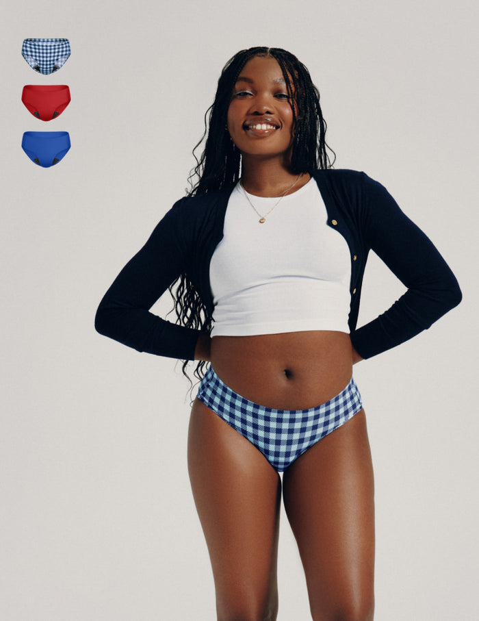 | Front view of model wearing the Teen Leakproof UltraThin No-Show Bikini highlighting the coverage and smooth fit | Gumdrop/Blueberry/Blue Gingham