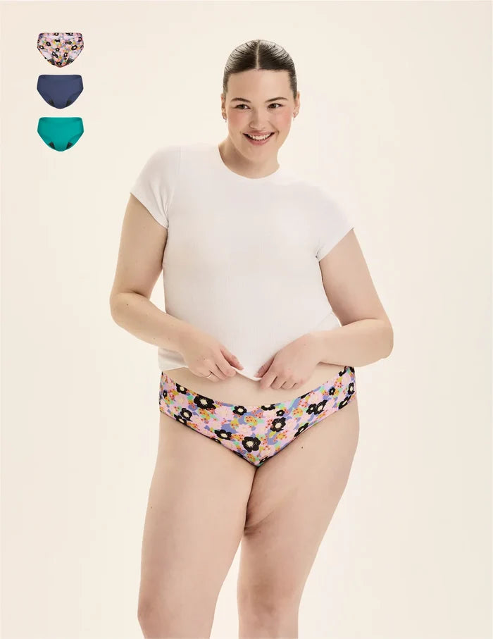 | Front view of model wearing the Teen Leakproof UltraThin No-Show Bikini highlighting the coverage and smooth fit | Electric Orchid/Teal Appeal/Lagoon