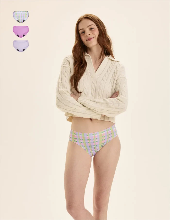 | Front view of model wearing the Teen Leakproof UltraThin No-Show Bikini highlighting the coverage and smooth fit | Picnic Plaid/Cosmo/Ultra Violet