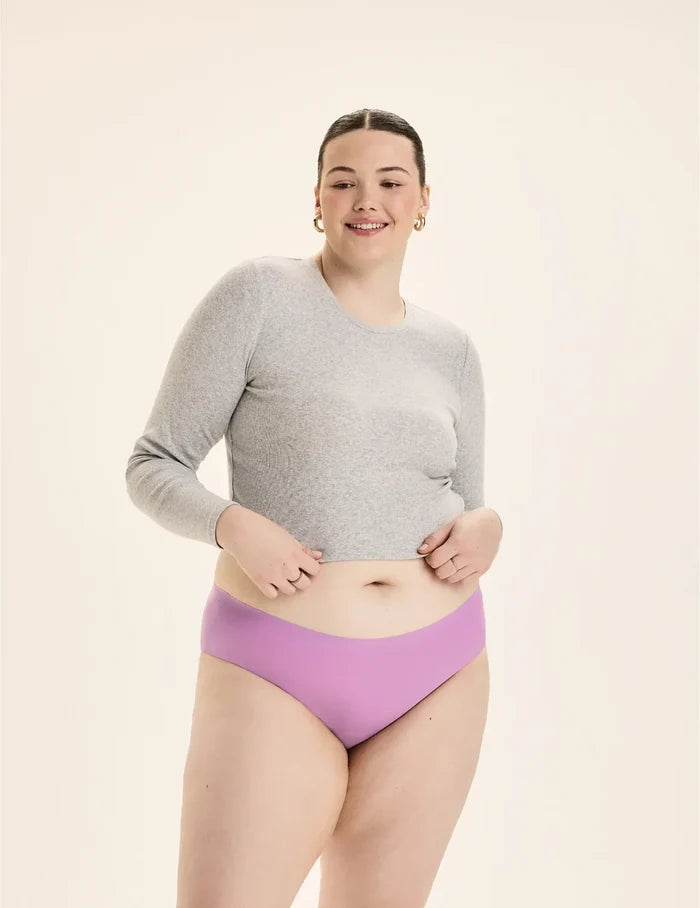 | Front view of model wearing the Teen Leakproof UltraThin No-Show Bikini highlighting the coverage and smooth fit | Cosmo
