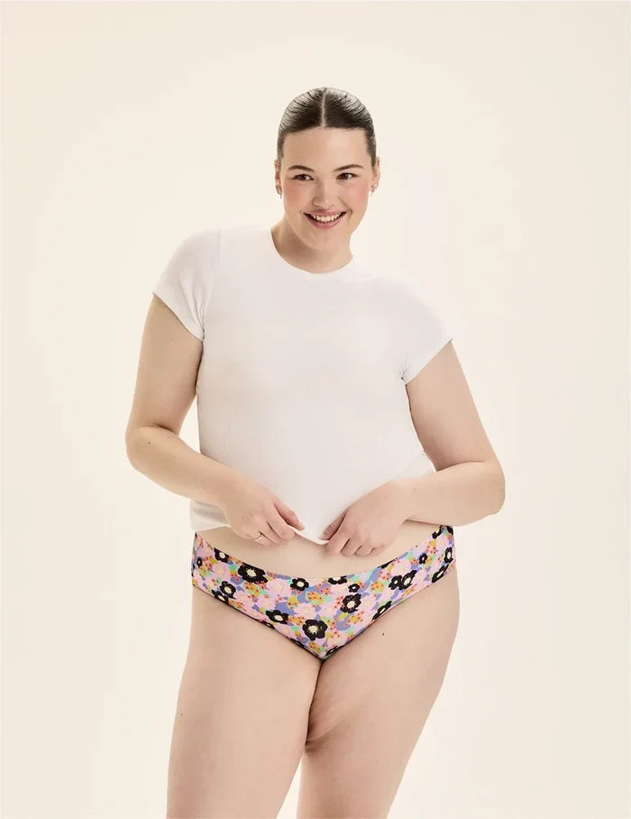 | Front view of model wearing the Teen Leakproof UltraThin No-Show Bikini highlighting the coverage and smooth fit | Electric Orchid