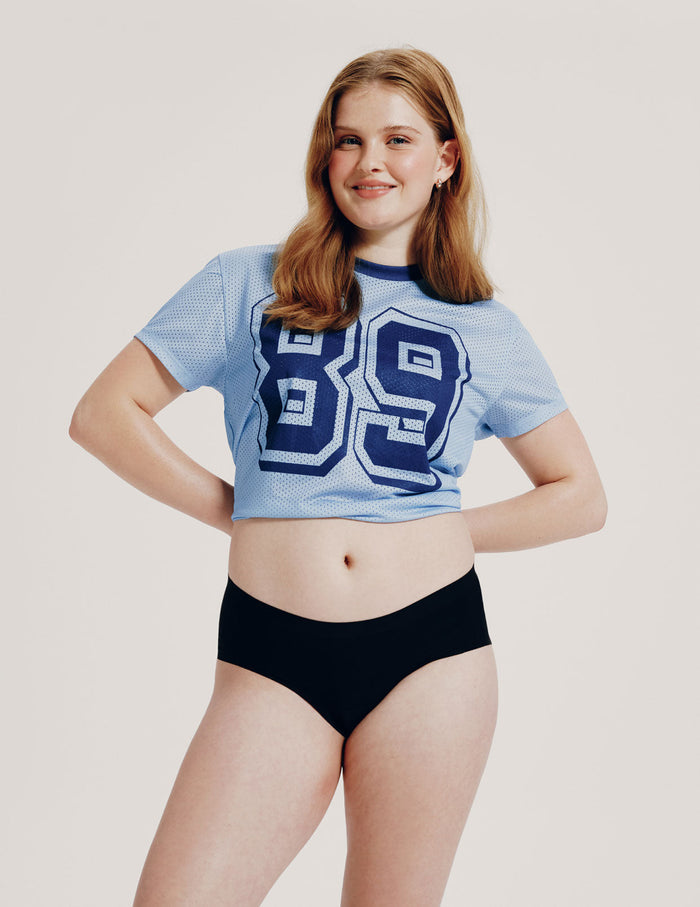 | Front view of model wearing the Teen Leakproof UltraThin No-Show Boyshort highlighting the coverage and smooth fit | Black