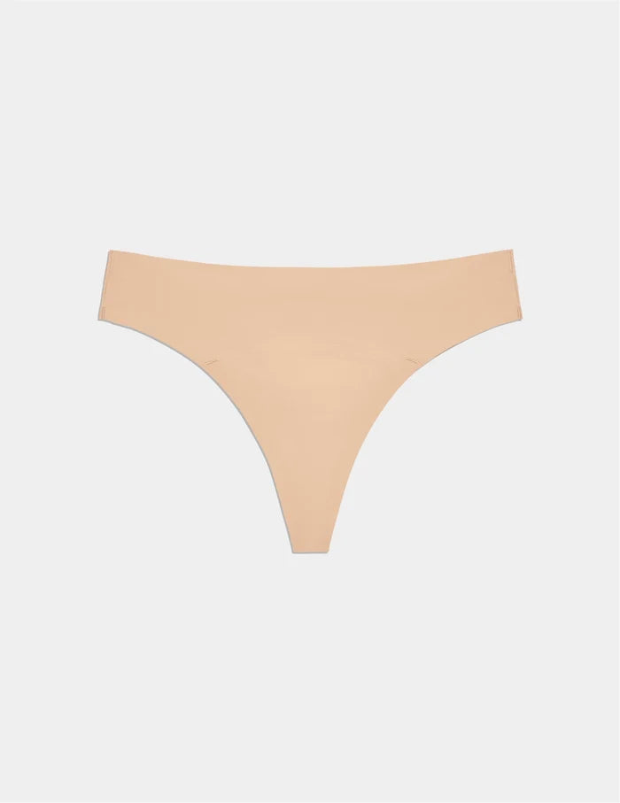 | Teen Leakproof UltraThin No-Show Thong shown front-facing against a light gray background | Warm Sand