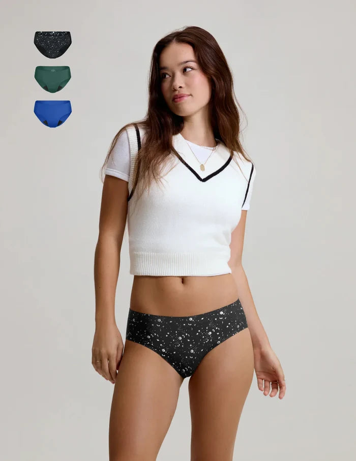 | Front view of model wearing the Teen Light Leakproof No-Show Bikini highlighting the coverage and smooth fit | Blueberry/Holly/Galaxy