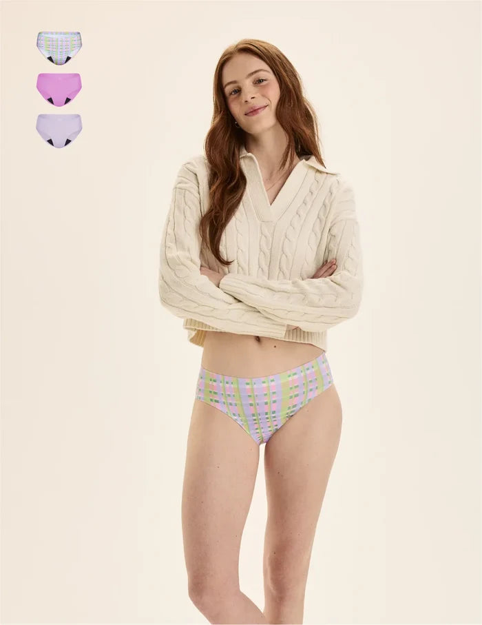 | Front view of model wearing the Teen Light Leakproof No-Show Bikini highlighting the coverage and smooth fit | Picnic Plaid/Cosmo/Ultra Violet
