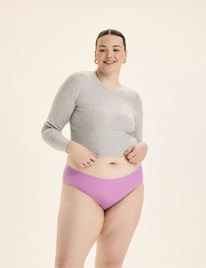 | Front view of model wearing the Teen Light Leakproof No-Show Bikini highlighting the coverage and smooth fit | Cosmo