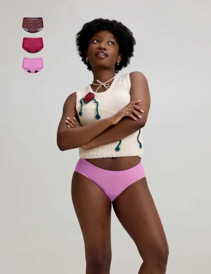 | Front view of model wearing the Teen Light Leakproof No-Show Boyshort highlighting the coverage and smooth fit | Ruby/Sugar Plum/Posy