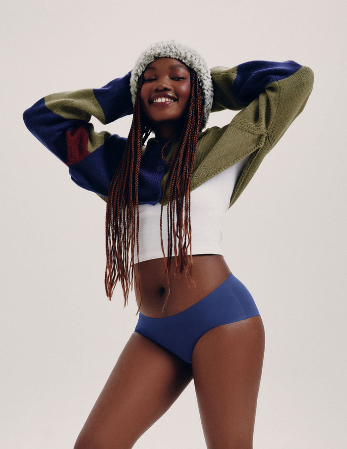 Tracy (she/her) has 37" hips and is wearing a size M | Front view of model wearing the Teen Light Leakproof No-Show Boyshort highlighting the coverage and smooth fit | Night Sky