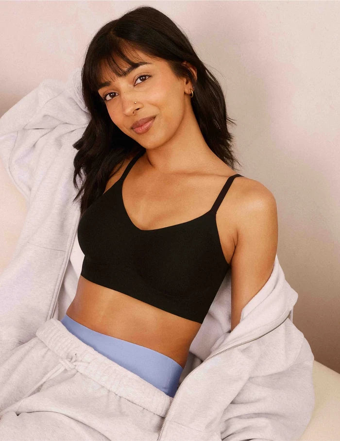 | Front view of model wearing the Teen On-The-Daily Bra, highlighting the neckline, pullover design, and silhouette | Black