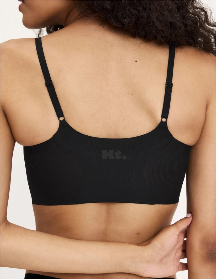 | Back view of model wearing the Teen On-The-Daily Bra, highlighting the neckline, pullover design, and silhouette | Black
