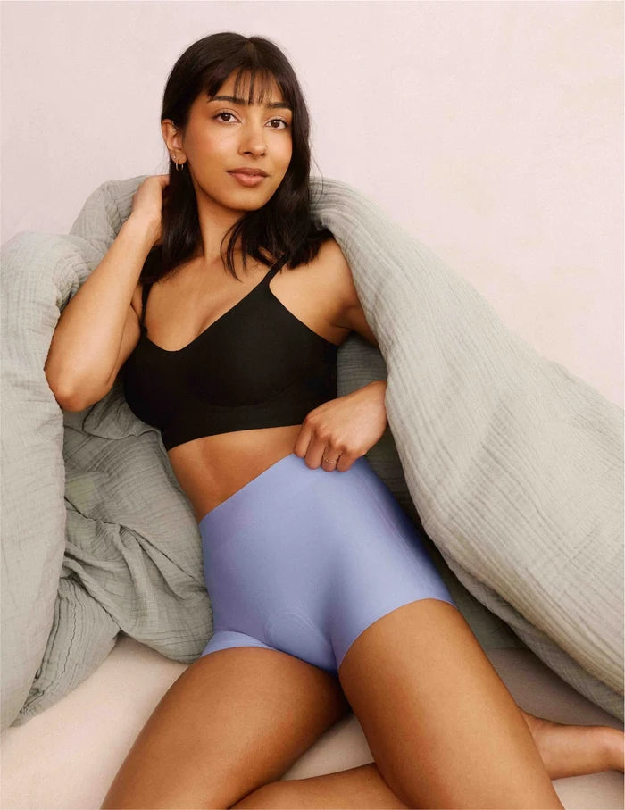 | Front view of model wearing the Teen On-The-Daily Bra, highlighting the neckline, pullover design, and silhouette | Black