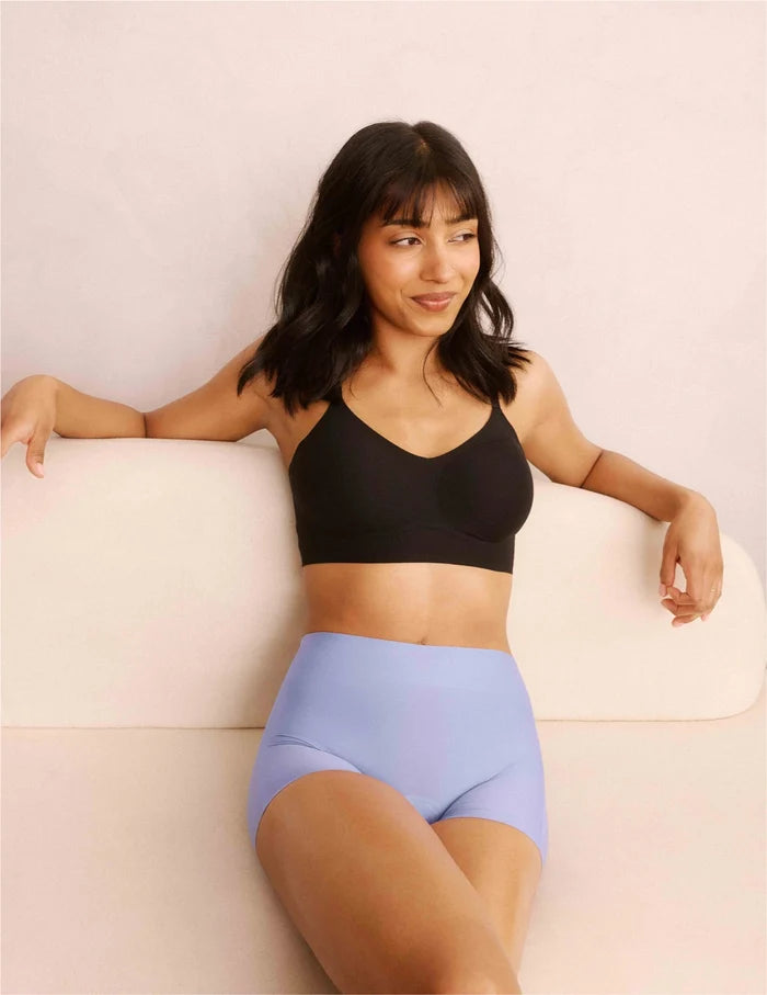 | Front view of model wearing the Teen On-The-Daily Bra, highlighting the neckline, pullover design, and silhouette | Black