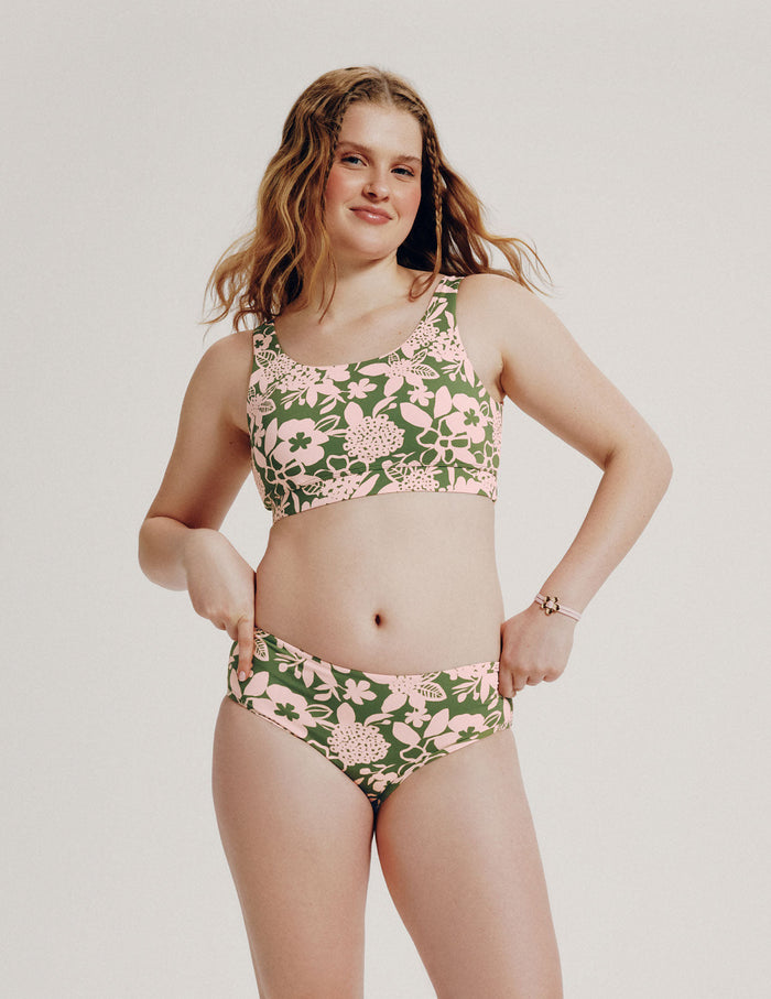 | Front view of model wearing the Teen Period Swim Full-Coverage Bikini Bottom highlighting the coverage and fit | Tropical Punch
