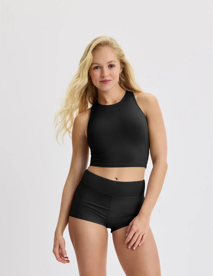 | Front view of model wearing the Teen Period Swim Short highlighting the coverage and fit | Black