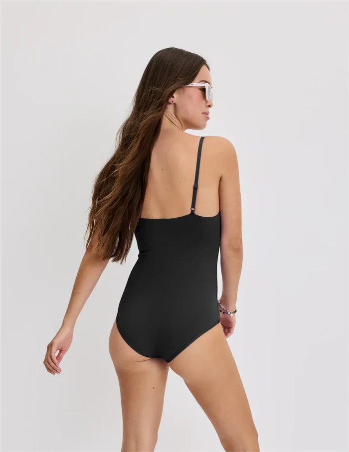 | Back view of model wearing the Teen Period Swim Square Neck One-Piece highlighting the coverage and fit | Black