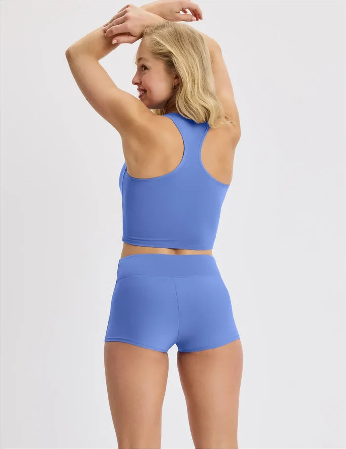 | Back view of model wearing the Teen Racerback Tankini Swim Top highlighting the coverage and fit | Wave Pool