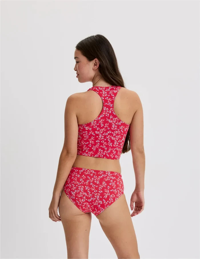 | Back view of model wearing the Teen Racerback Tankini Swim Top highlighting the coverage and fit | Poppy Petal
