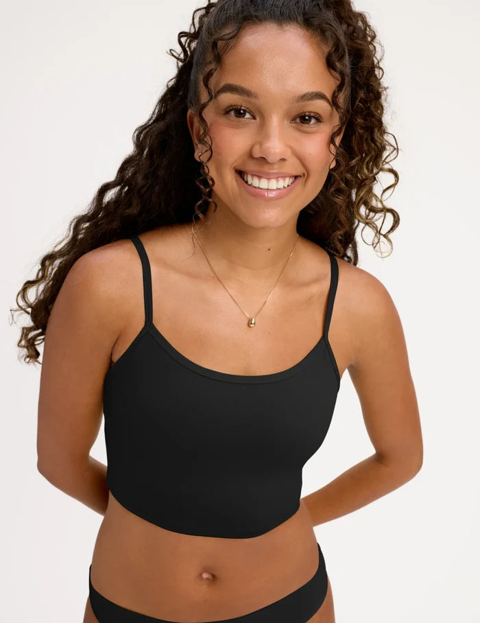 | Front view of model wearing the Teen Scoop Tankini Top highlighting the coverage and fit | Black