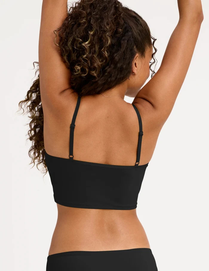 | Back view of model wearing the Teen Scoop Tankini Top highlighting the coverage and fit | Black