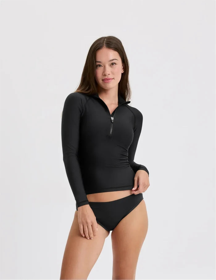 | Front view of model wearing the Teen Sunny Skies Rash Guard highlighting the coverage and fit | Black