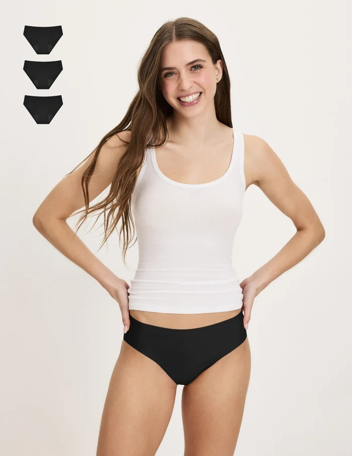 | Front view of model wearing the Teen Super Leakproof® No-Show Bikini highlighting the coverage and smooth fit | Black