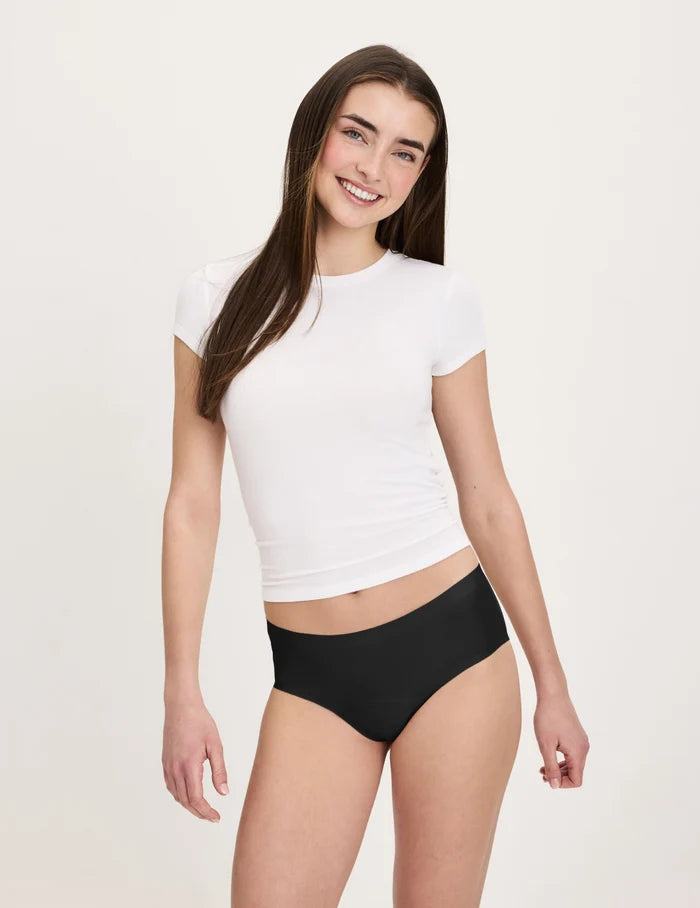 | Front view of model wearing the Teen Super Leakproof® No-Show Boyshort highlighting the coverage and smooth fit | Black