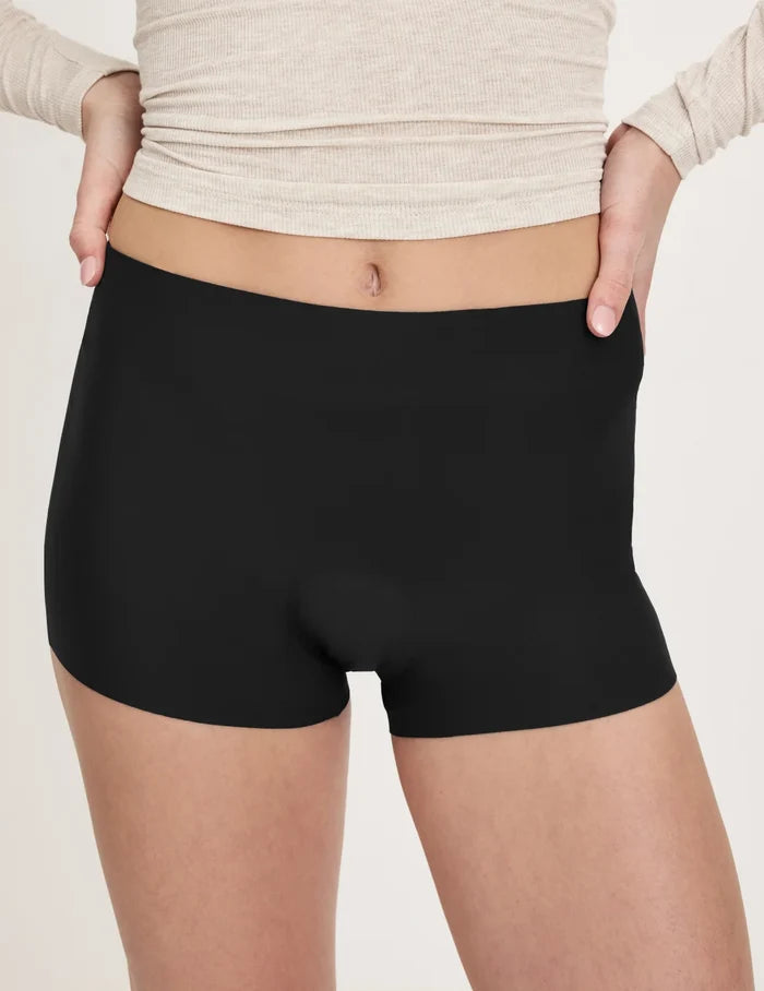 | Front view of model wearing the Teen Super Leakproof® Sleepover Short highlighting the coverage and smooth fit | Black