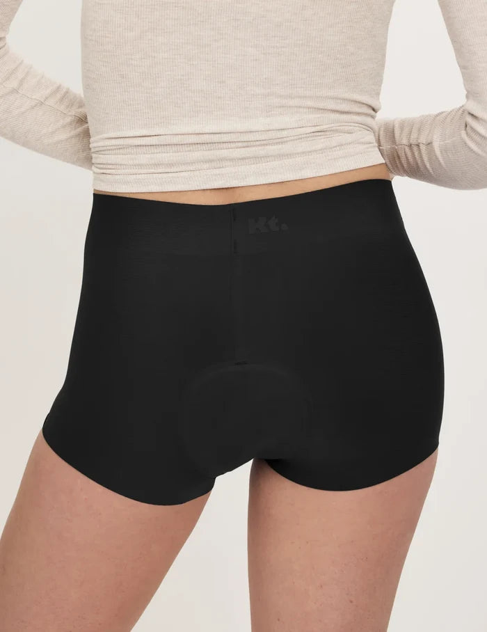 | Back view of model wearing the Teen Super Leakproof® Sleepover Short highlighting the coverage and smooth fit | Black